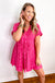 Flowy and casual pink printed mini dress, ideal for effortless summer style